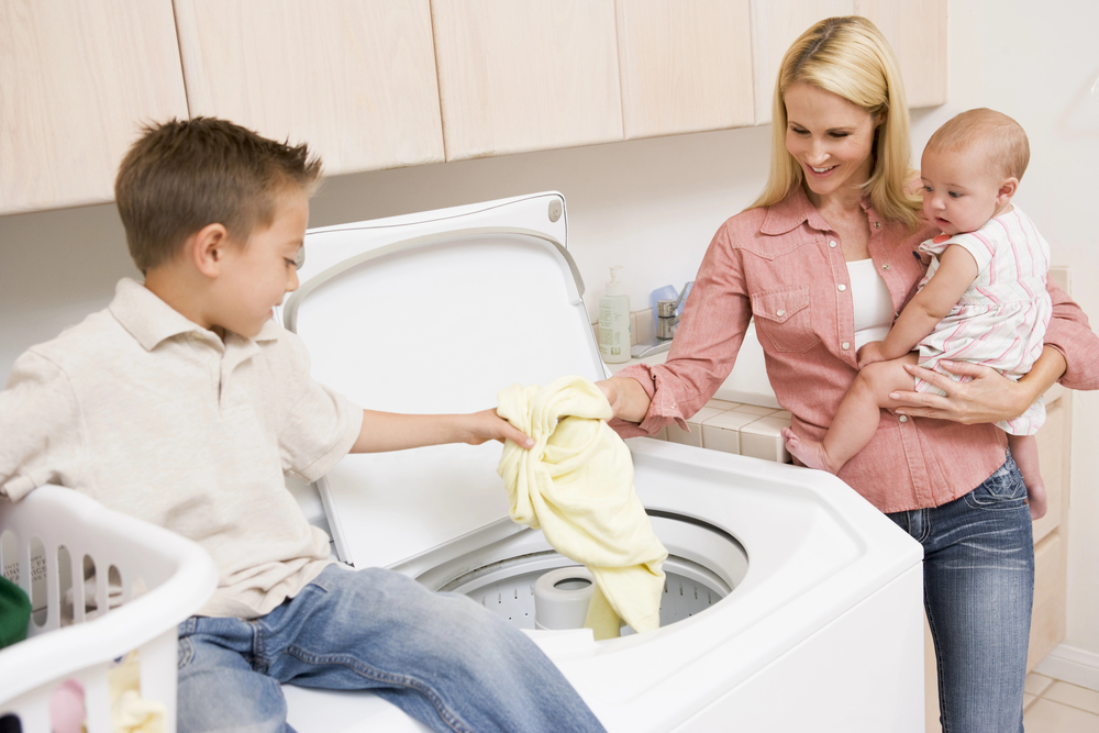 Mom and son doing laundry together